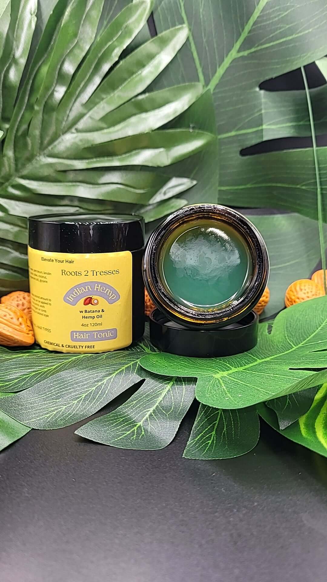 Roots 2 Tresses Hair Tonic open to see what it looks like 